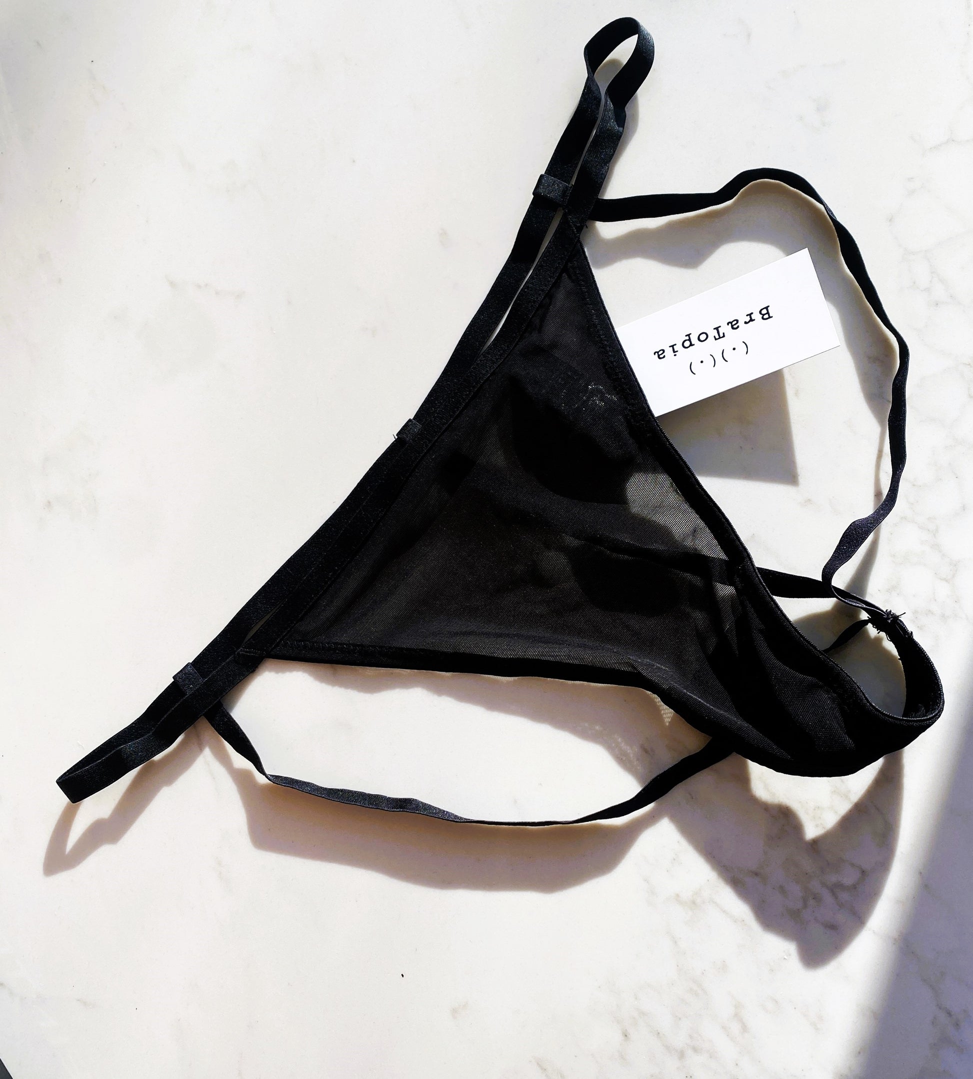Kiera Panty In Black - Playful Promises, front view of product picture with BraTopia tag on it