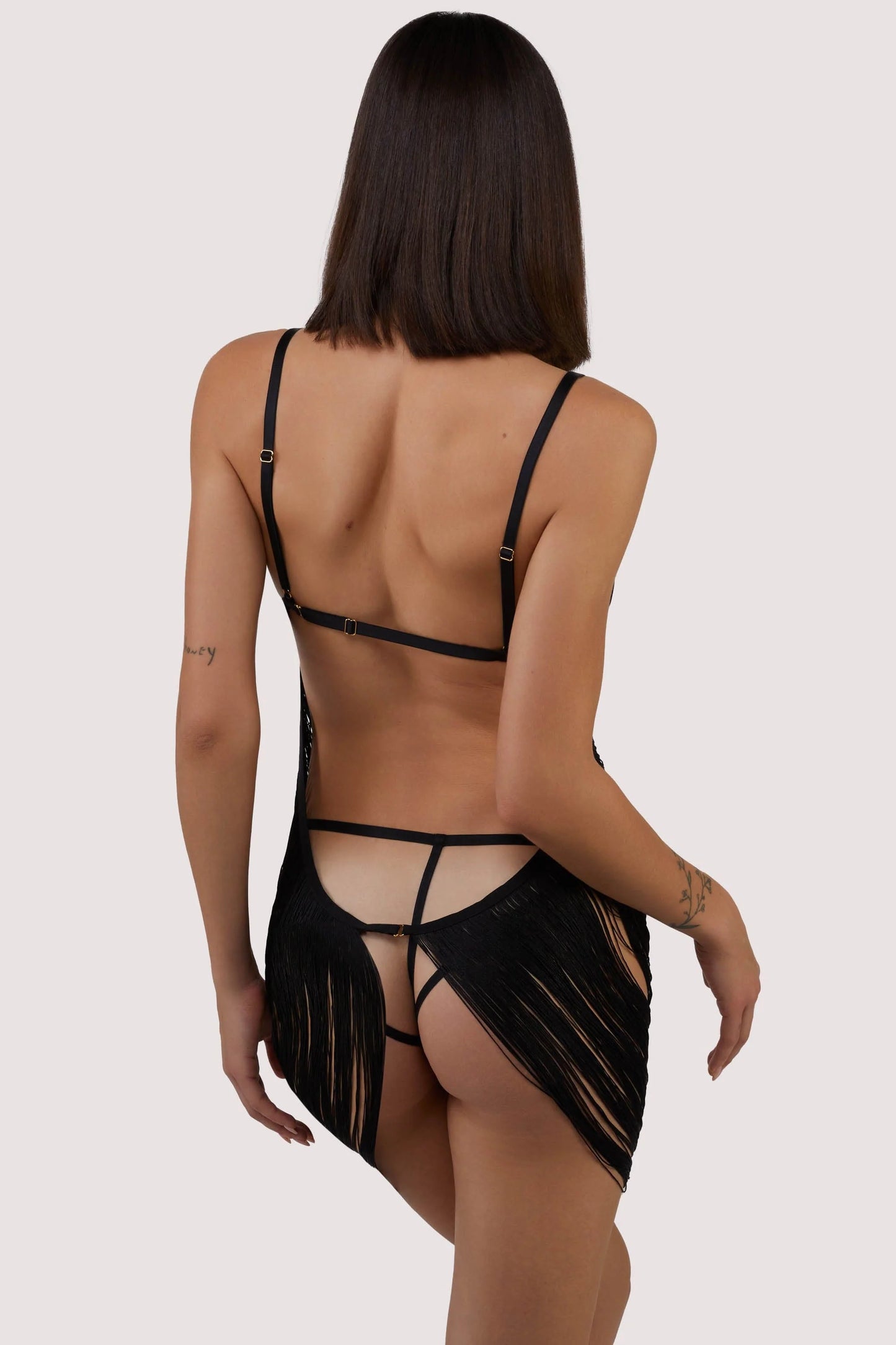 Model wearing Kiera Fringe Dress In Black - Playful Promises, back view
